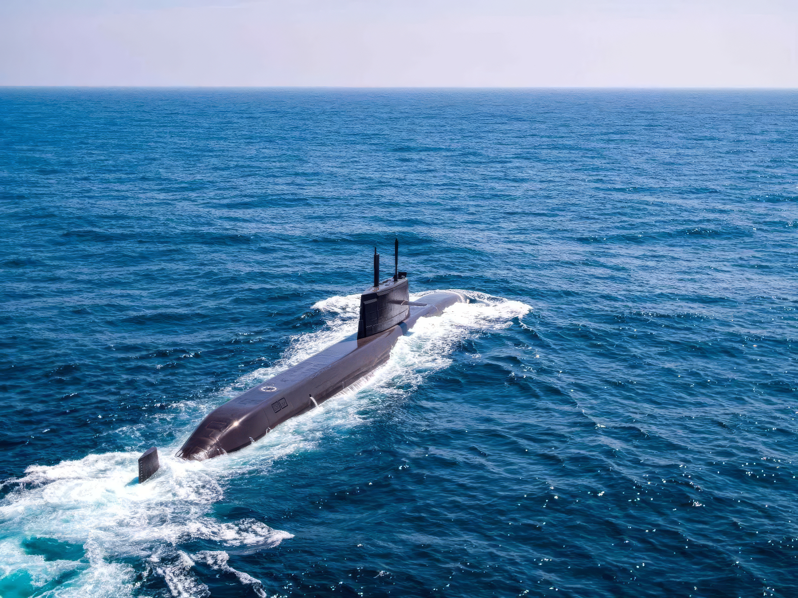 KSS-III Dosan Ahn Changho class submarine underway at sea — showing the elongated hull profile, conning tower fairwater planes, and the hull section forward of the sail where vertical launch tubes are housed. By 방위사업청 - Defense Acquisition Program Administration (DAPA) - https://www.dapa.go.kr/common/ntt